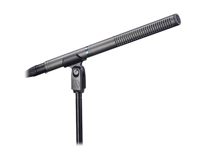 The Audio-Technica AT897 mic, on a mic stand against a white background.
