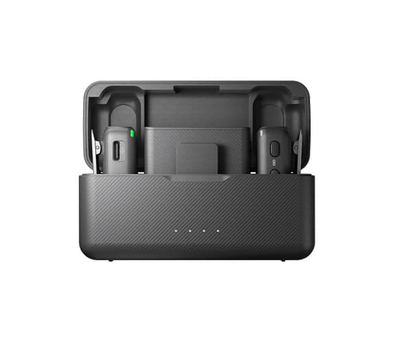 A close up of the DJI Mic 2 in it's black carry case, with the lid open.