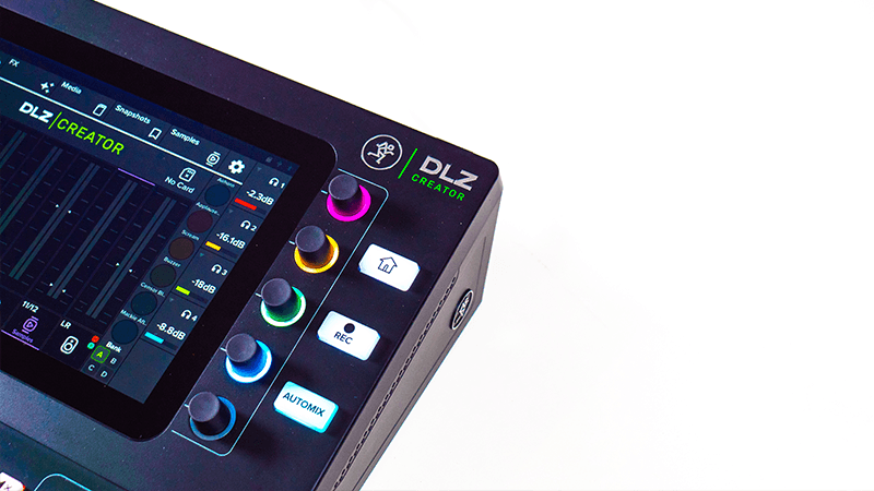 A close up of the Mackie DLZ Creator, showing it's top right corner. Part of the screen is visible, alongside the 5 headphone knobs and the automix, record and home button.